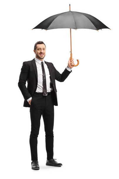 Homme d'affaires tenant un parapluie ouvert
 - Photo, image