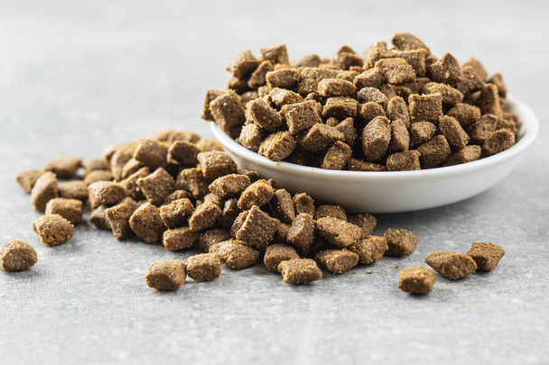 Dry pet food. Kibble dog or cat food. - Foto, afbeelding