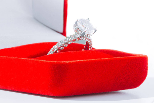 Diamond engagement ring in red box on white background - 写真・画像