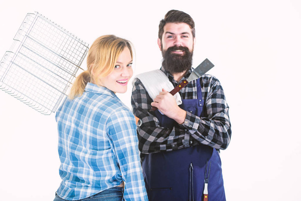 Real love. Tools for roasting meat. Couple in love hold kitchen utensils. Family weekend. Man bearded hipster and girl. Preparation and culinary. Picnic barbecue. food cooking recipe - Photo, image