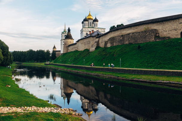 Ancient Pskov Kremlin on river bank, Trinity church, day time - Foto, immagini