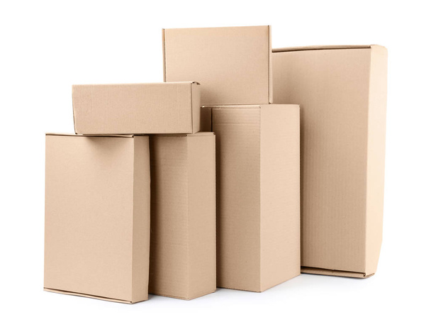 Pile of cardboard boxes on white background - Fotó, kép