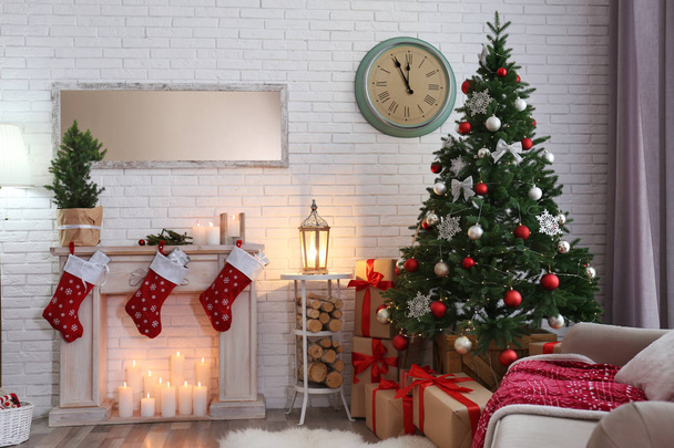 Stylish interior with beautiful Christmas tree and decorative fireplace - Foto, Bild