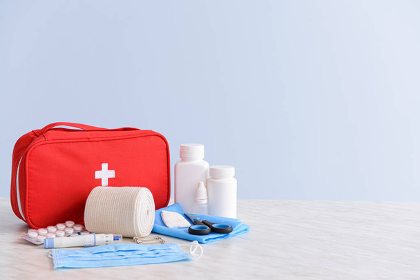 First aid kit on table - Fotó, kép