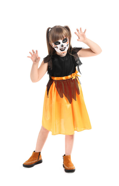 Little girl in Halloween costume on white background - Фото, зображення
