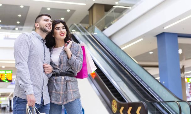 Loving couple spending time together after shopping - Photo, Image