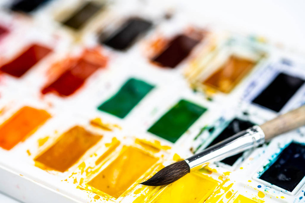 Set watercolor paints with paintbrush. Art concept - Foto, afbeelding