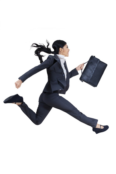Young businesswoman with briefcase running for success - Foto, Imagen
