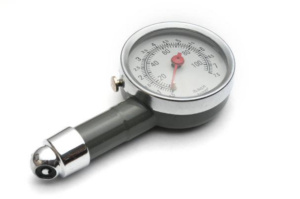 Pressure gauge for measuring air pressure in car tires on a whit - Fotó, kép