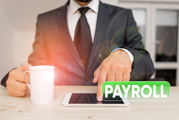 Woord schrijven tekst Payroll. Bedrijfsconcept voor Bedrag van de lonen en salarissen die een onderneming aan haar werknemers betaalt. - Foto, afbeelding