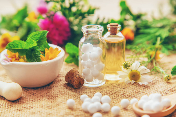 Homeopathy. Herbal extracts in small bottles. Selective focus. - Photo, image