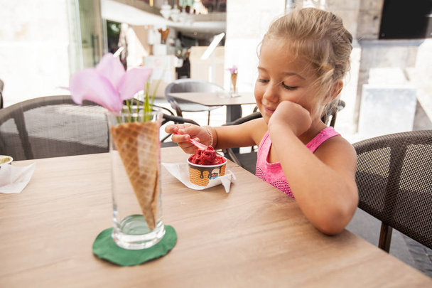 Cute Little Girl Eating Ice Cream Outdoor Cafe  - Photo, image