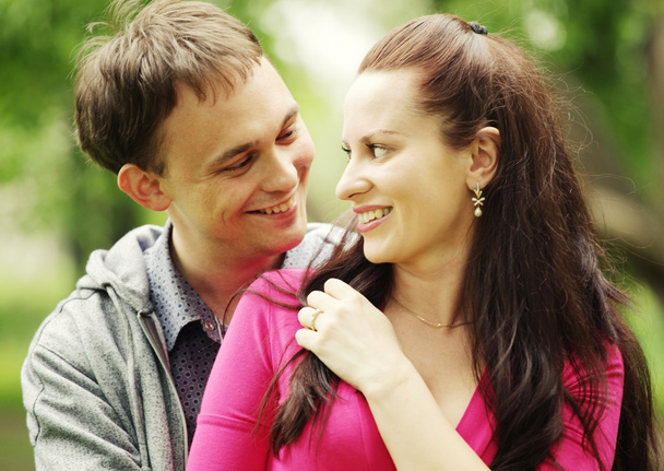 Portrait of love couple embracing outdoor in park - Foto, immagini