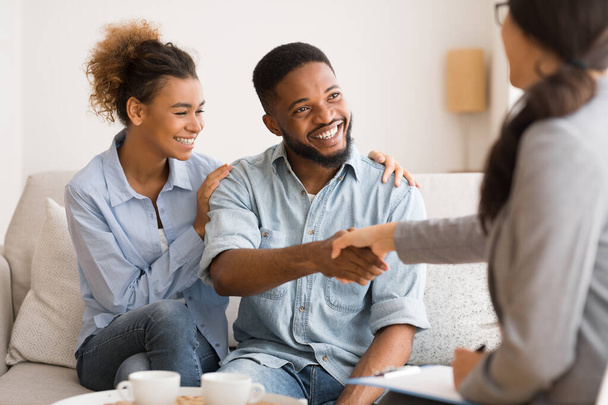 Young African American Couple Handshaking With Marriage Counselor After Therapy - Photo, Image