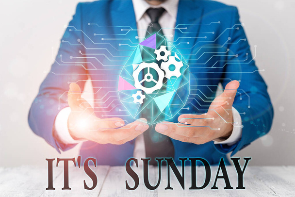 Writing note showing It S Sunday. Business photo showcasing Day of rest and religious worship Part of the weekend Male human wear formal suit presenting using smart device. - Photo, Image