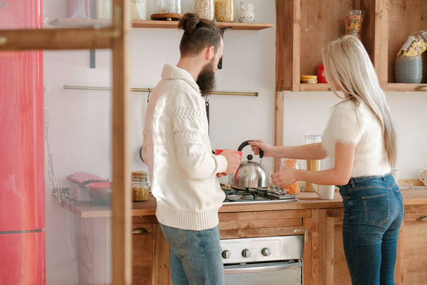 family morning routine couple tea modern kitchen - Фото, изображение