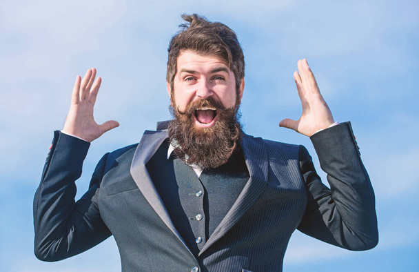 Success and luck. Optimistic mood. Think like optimist. Being optimistic. Hopeful and confident about future. Unexpected luck. Man bearded optimistic businessman wear formal suit sky background - Foto, afbeelding