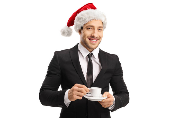 Young professional man in suit and tie holding a cup of espresso - Foto, Bild