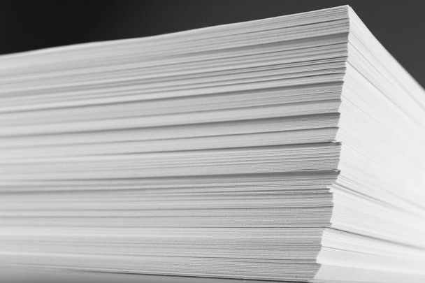 Stack of blank white paper on grey background, closeup - Foto, immagini