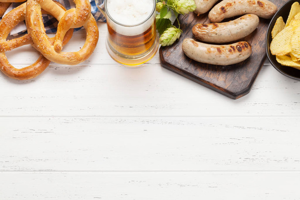 Oktoberfest set. Pretzels, sausages and lager beer - Φωτογραφία, εικόνα