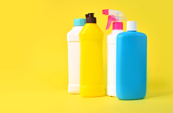 Set of plastic bottles on a yellow background - Fotó, kép