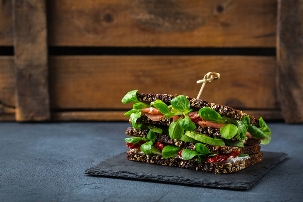 Fresh rye bread sandwich with ham, lettuce and tomato - Photo, Image
