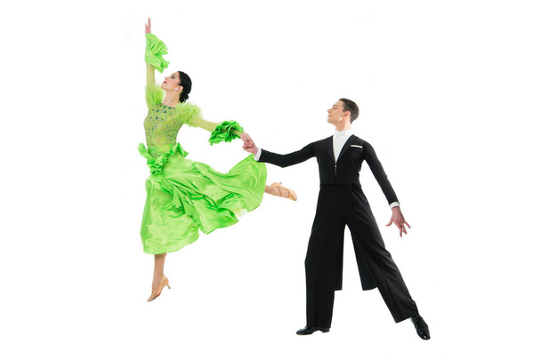 ballroom dance couple in a dance pose isolated on white background. ballroom sensual proffessional dancers dancing walz, tango, slowfox and quickstep just dance - 写真・画像