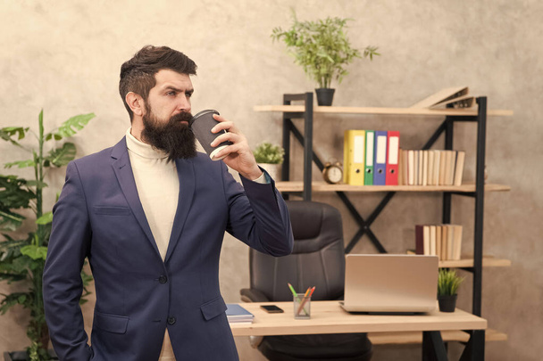 Businessman in formal outfit drink coffee. Confident man. Boss workplace. Coffee break. Bearded man in business office drink tea. time to drink coffee. coffee on the go. some free time - Фото, изображение