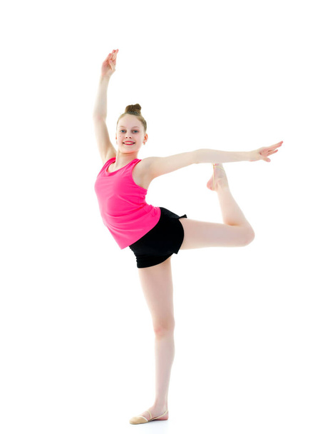 The gymnast balances on one leg. - Foto, Imagem