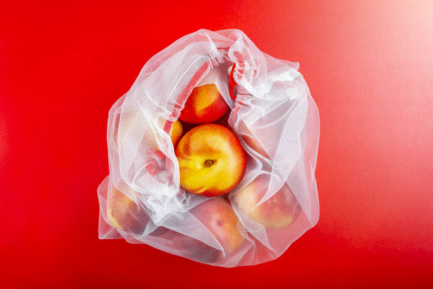 コットンストリングメッシュバッグ、食料品用再利用可能なショッピングトート - 写真・画像
