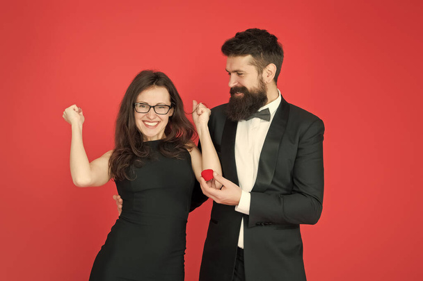 finally. valentines day celebration. happy sexy couple in love. tuxedo man and lady at engagement celebration. bearded man make woman marriage proposal. formal couple. ring in box. love date. yes - Photo, image