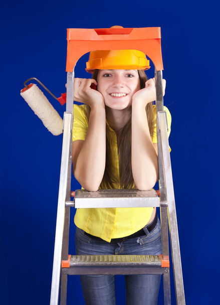 Girl with paint rollers on stepladder - Φωτογραφία, εικόνα