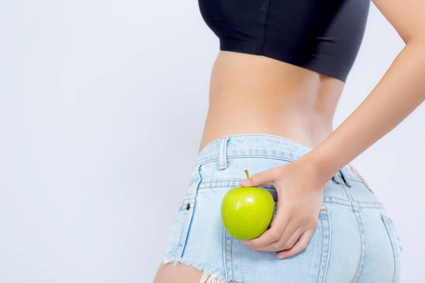 Closeup beautiful body woman sexy slim holding green apple with  - Photo, Image