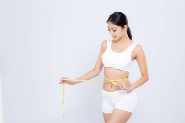 beautiful portrait asian woman diet and slim with measuring wais - Foto, Imagen