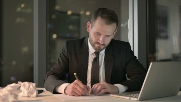 Ambitious Businessman trying to Write Document at Night - Video