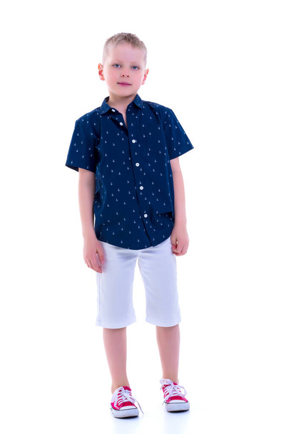 Handsome little boy in full growth on a white background. The co - Foto, immagini