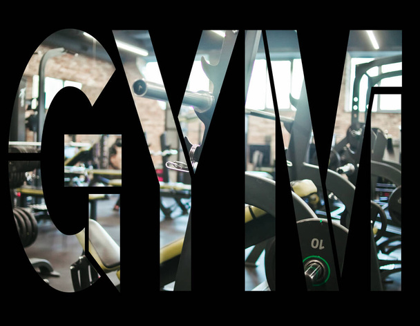 Αθλητικός εξοπλισμός φωτογραφικού γυμναστηρίου με τη μορφή της λέξης γυμναστήριο - Φωτογραφία, εικόνα