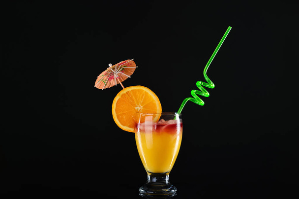 Glass of tasty cocktail on dark background - Photo, Image