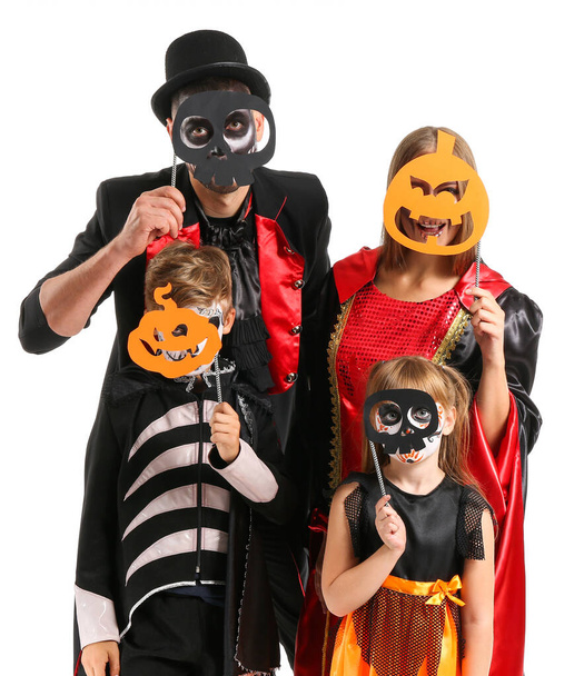 Family in Halloween costumes on white background - Photo, Image
