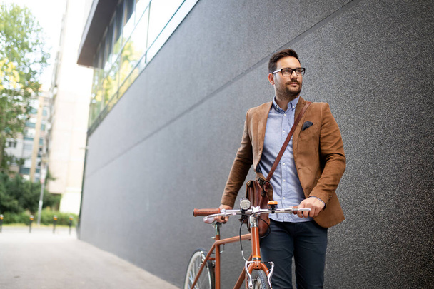 Businessman riding bicycle to work in morning. Way to office. - Foto, immagini