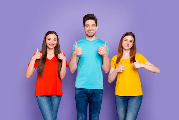 Portrait of nice-looking attractive lovely cheerful cheery content guys wearing colorful t-shirts showing thumbup ad advert isolated over violet lilac background - Φωτογραφία, εικόνα