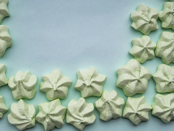 mint green meringues over mint backdrop with copy space - Φωτογραφία, εικόνα