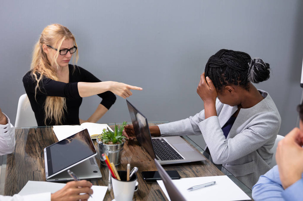 Angry Business Woman Blaming Female Colleague In Meeting For Business Mistake In Office - Photo, Image