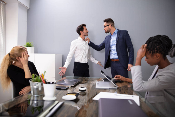 Dissatisfied CEO Shouting At His Young Male Worker For Bad Performance In Front Of Coworkers - Photo, image