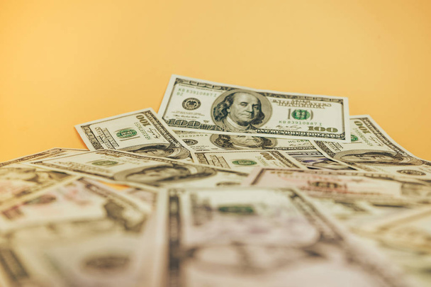 Dollars Close up Concept. American Dollars Cash Money on a yellow background. - Foto, afbeelding