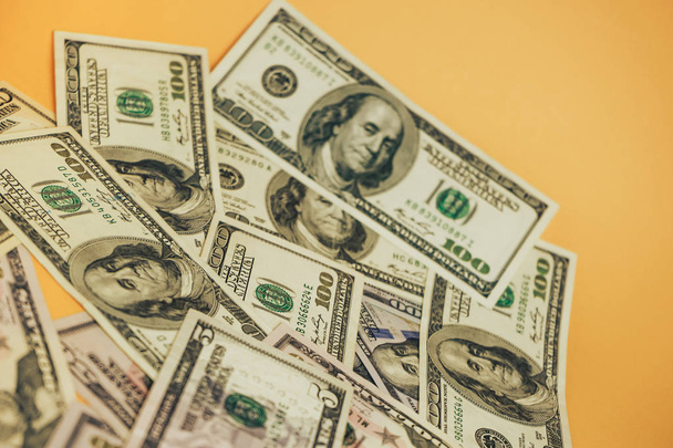 Dollars Close up Concept. American Dollars Cash Money on a yellow background. - 写真・画像