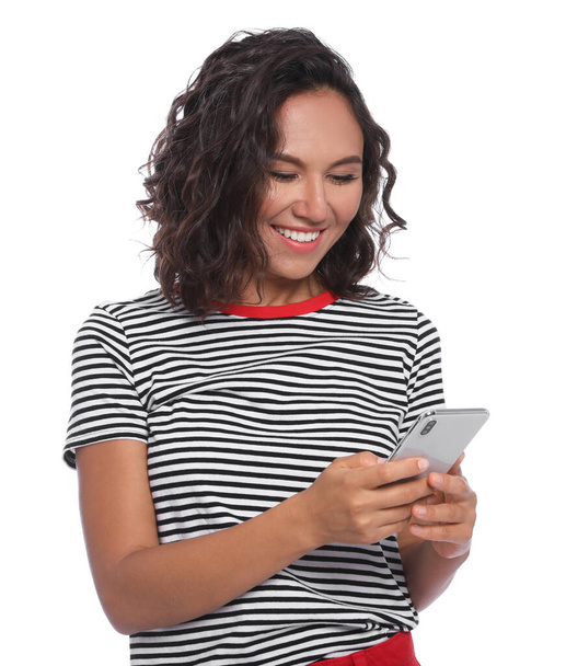 Happy young woman using smartphone on white background - Photo, Image