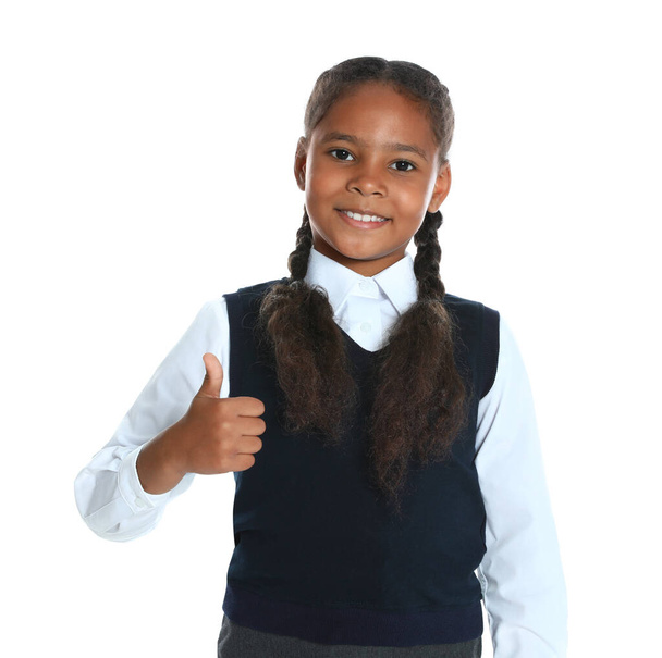 Happy African-American girl in school uniform on white background - Zdjęcie, obraz
