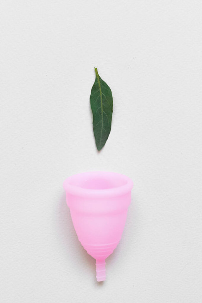 Women health concept, zero waste. Pink menstrual cup. Alternative reusable product. Minimalism - Foto, Imagen