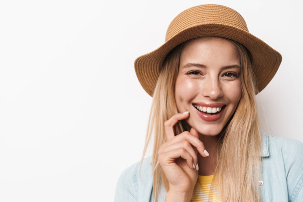 Happy smiling optimistic young pretty woman wearing hat posing isolated over white wall background. - Photo, Image
